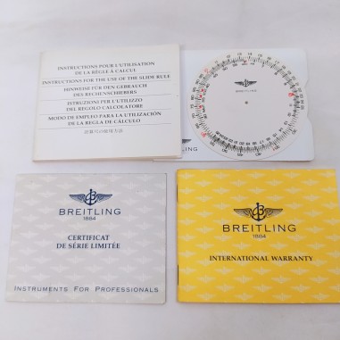 Lotto 2 certificati Breitling e regolo calcolatore con istruzioni Buono