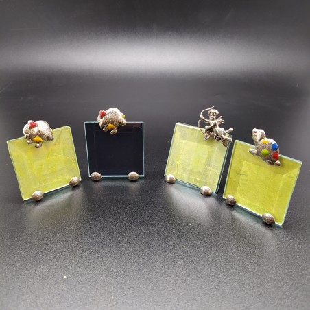 Lotto di 4 piccole cornici portafoto con elementi in argento 800