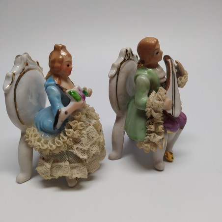 Coppia di ceramiche figurini settecenteschi suonatore e damina