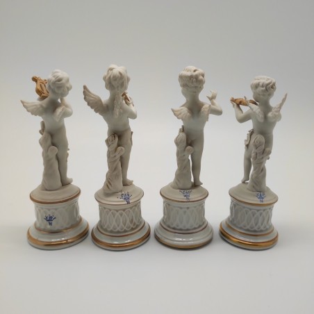 Lotto di 4 statuine in biscuit Capodimonte angioletti sunatori
