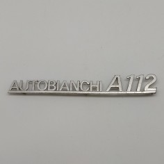 Fregio Autobianchi A 112 in metallo con segni di ossidazione