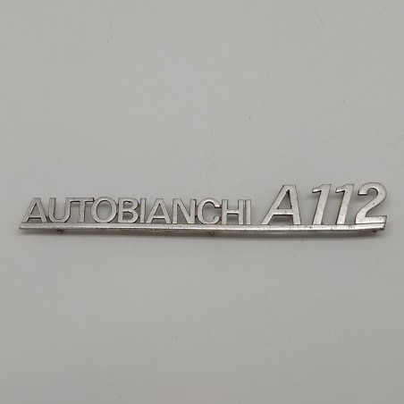 Fregio Autobianchi A 112 in metallo con segni di ossidazione