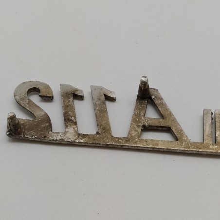 Fregio Autobianchi A 112 in metallo con segni di ossidazione