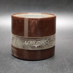 Cofanetto per orologio Longines rotondo marrone e argentato con segni di umidità