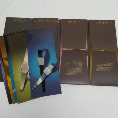 Catalogo a cofanetto "Orologi & Stile Omega" con cartoncini di tre collezioni 2