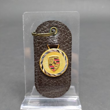 Portachiavi Porsche in pelle testa di moro, logo su medaglia basculante. Buono