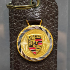 Portachiavi Porsche in pelle testa di moro, logo su medaglia basculante. Buono 2