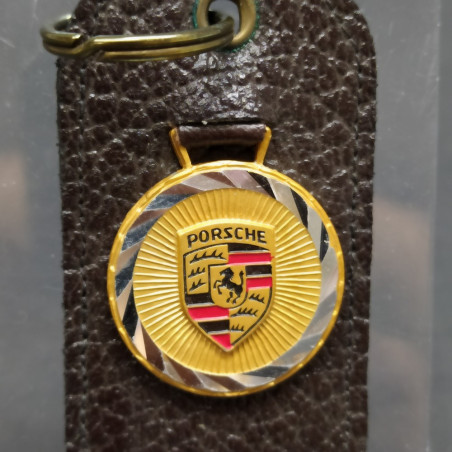 Portachiavi Porsche in pelle testa di moro, logo su medaglia basculante. Buono