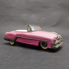 Modellino auto giocattolo in latta rosa a retrocarica. Scolorita, ossidata