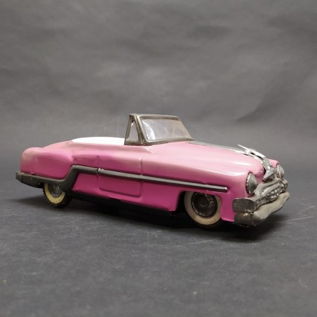 Modellino auto giocattolo in latta rosa a retrocarica. Scolorita, ossidata