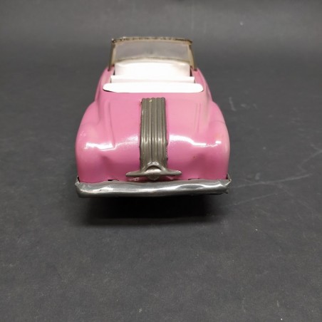 Modellino auto giocattolo in latta rosa a retrocarica. Scolorita, ossidata