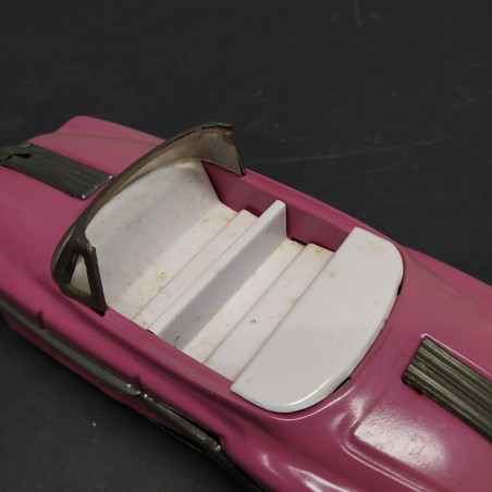 Modellino auto giocattolo in latta rosa a retrocarica. Scolorita, ossidata