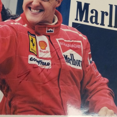 Lotto di 2 fotografie del pilota di F1 Michael Schumacher con autografo. Graffi